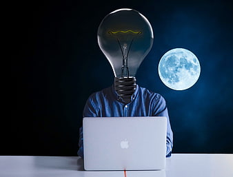 Conceptual man with lightbulb head working on laptop with moon background