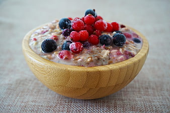 Healthy Overnight Oats With Fresh Berries In Wooden Bowl