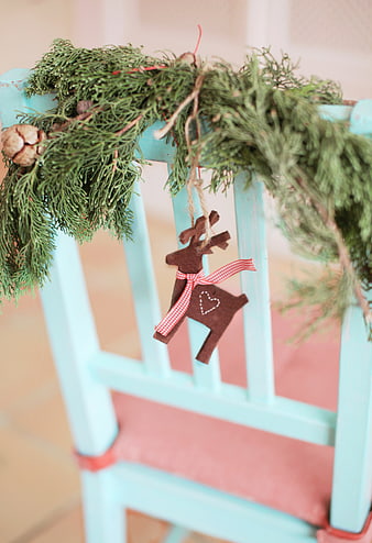 Rustic Christmas Reindeer Ornament on Blue Chair