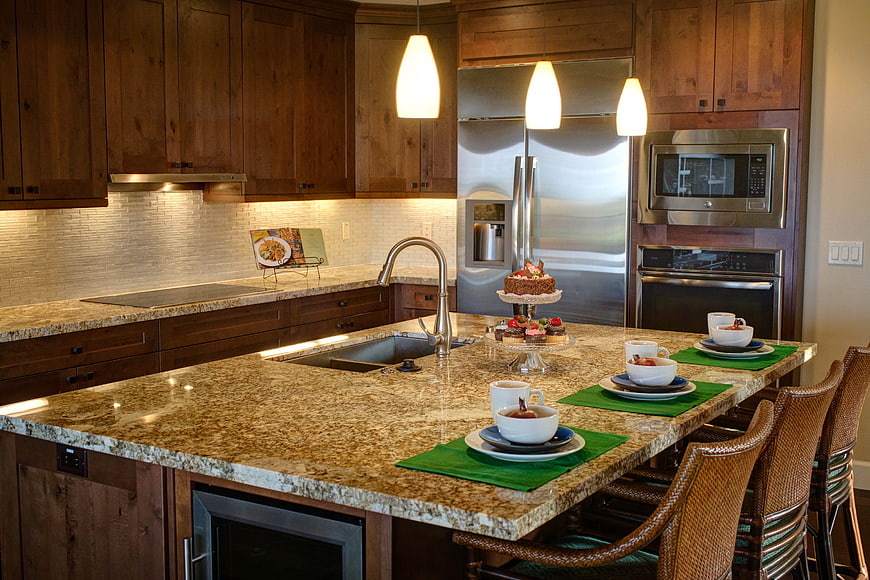 Luxury Kitchen Interior With Granite Island And Stainless Steel Appliances