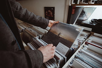 Man browsing vinyl records in a record store