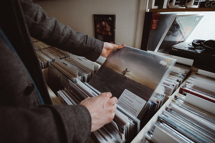 Man browsing vinyl records in a record store