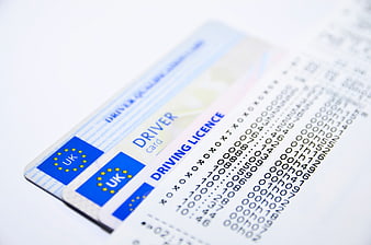 UK Driver Card and Tachograph Printout on White Background