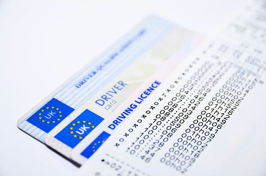 UK Driver Card and Tachograph Printout on White Background