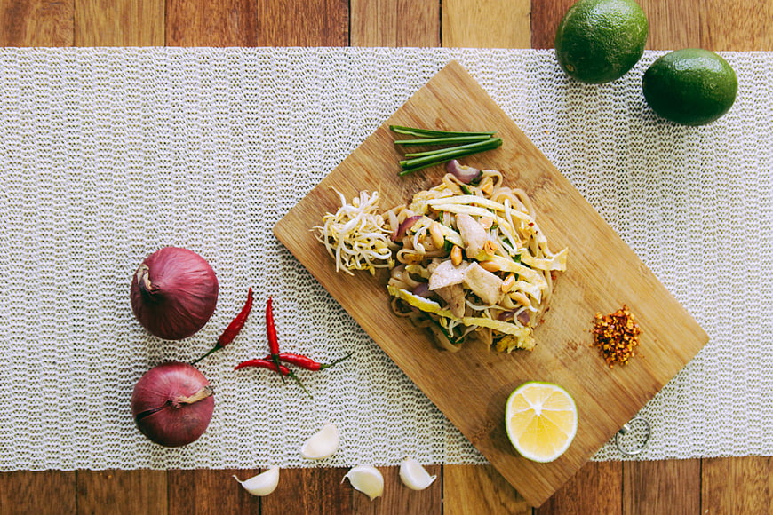 Overhead View of Pad Thai Noodles with Fresh Vegetables and Herbs