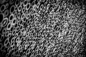 Black and white pattern of stacked bamboo logs