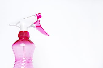 Pink Spray Bottle on White Background with Copy Space