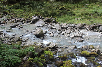 Rock Cairns in a Rocky Mountain Stream