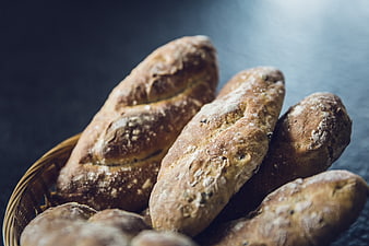 Rustic Artisan Bread Loaves in Wicker Basket