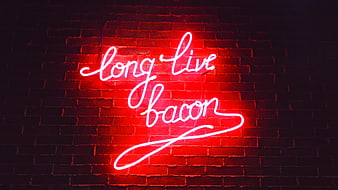Red Neon Sign Saying Long Live Bacon on Brick Wall