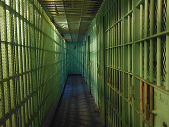 Empty Green Prison Cell Block Corridor With Metal Bars