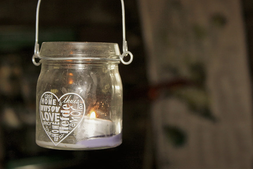 Hanging glass jar lantern with candle and heart text