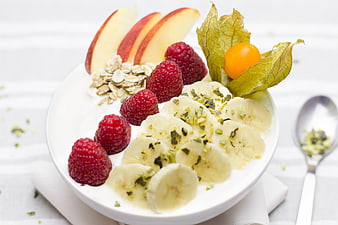 Healthy Breakfast Bowl With Fresh Fruit, Yogurt, And Nuts