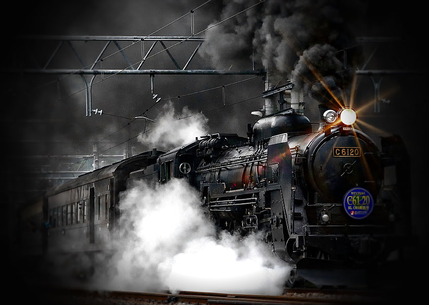 Vintage Steam Locomotive Billowing Smoke on Tracks