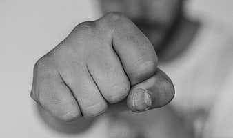 Close-up of clenched fist in black and white