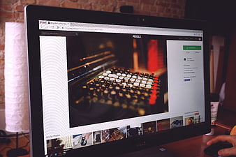 Computer Monitor Displaying Pexels Website in Office