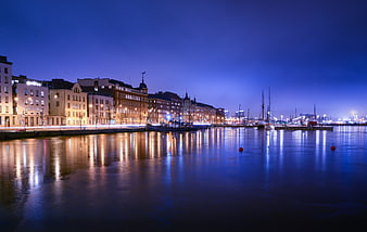 Helsinki waterfront skyline at twilight with reflections