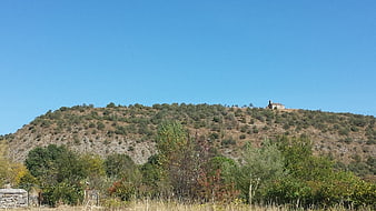 Small stone chapel on a hilltop in Ardèche, France