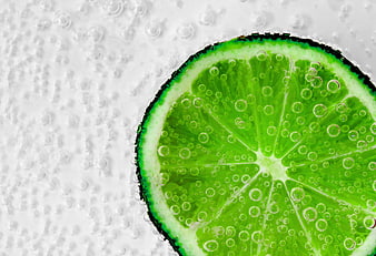 Fresh Lime Slice In Carbonated Water Close Up