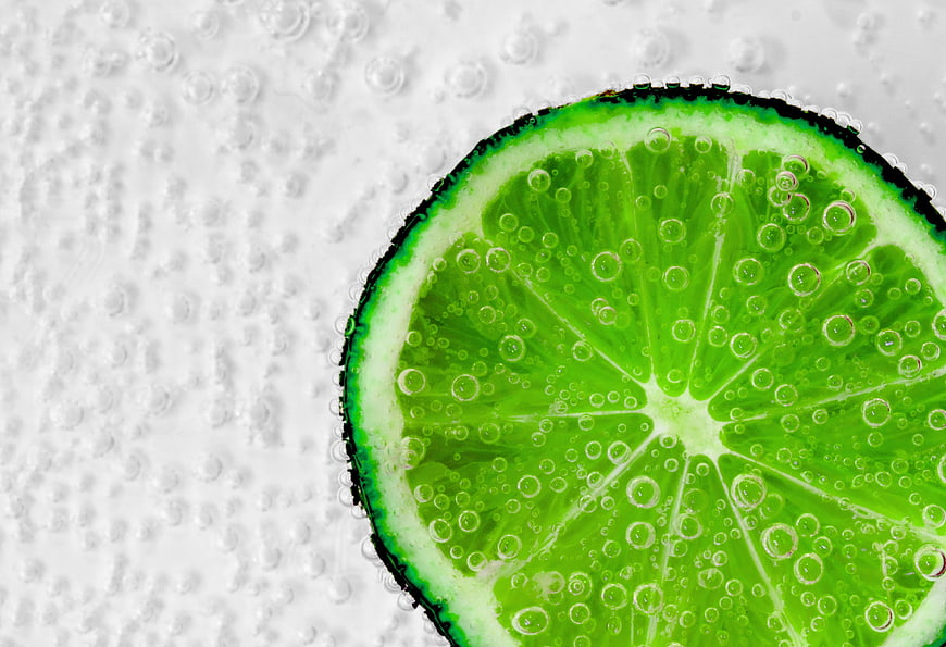 Fresh Lime Slice In Carbonated Water Close Up