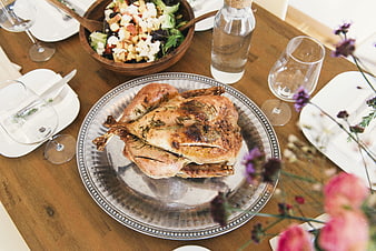Overhead view of roasted chicken dinner table setting