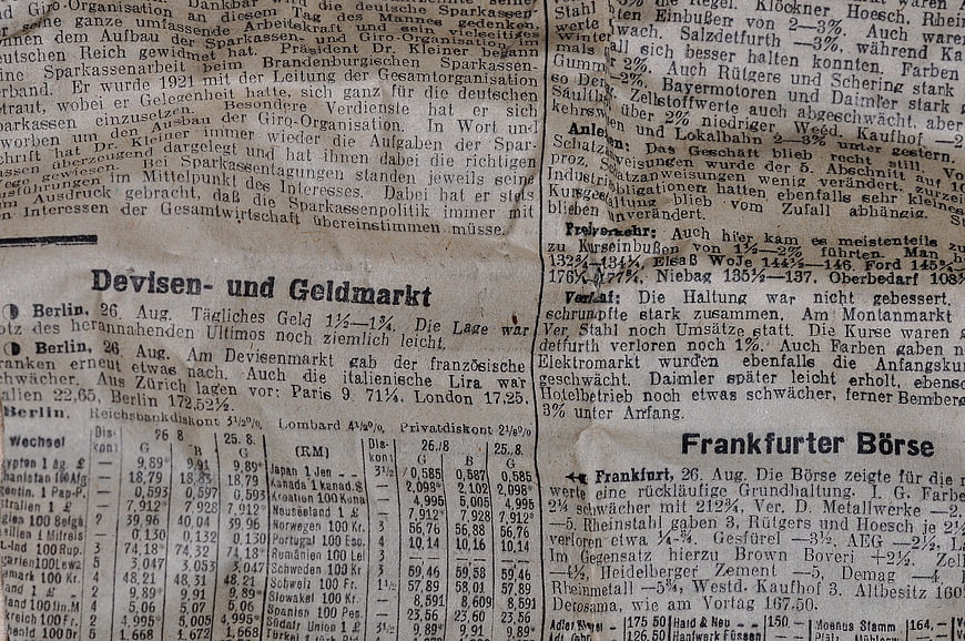 Close-up of vintage German newspaper text and financial market data