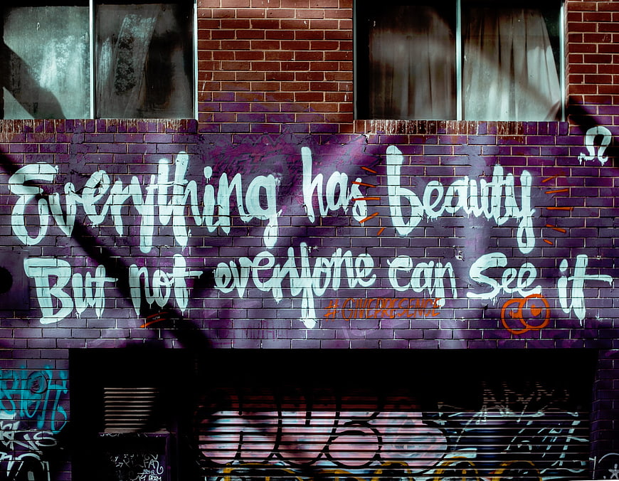 Urban Graffiti Quote On Purple Brick Wall