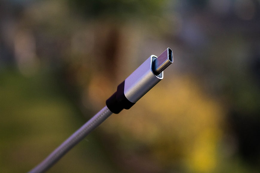 Close-up of silver USB-C connector on braided cable