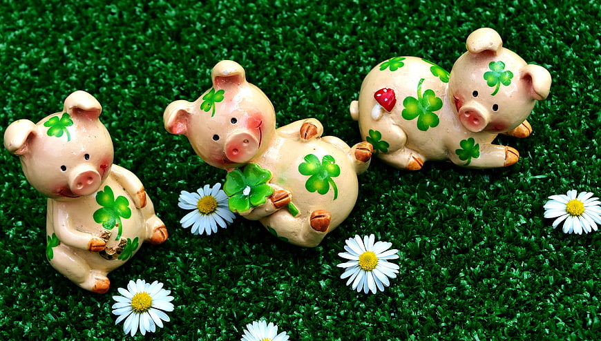 Three Ceramic Lucky Pigs With Shamrocks On Green Grass