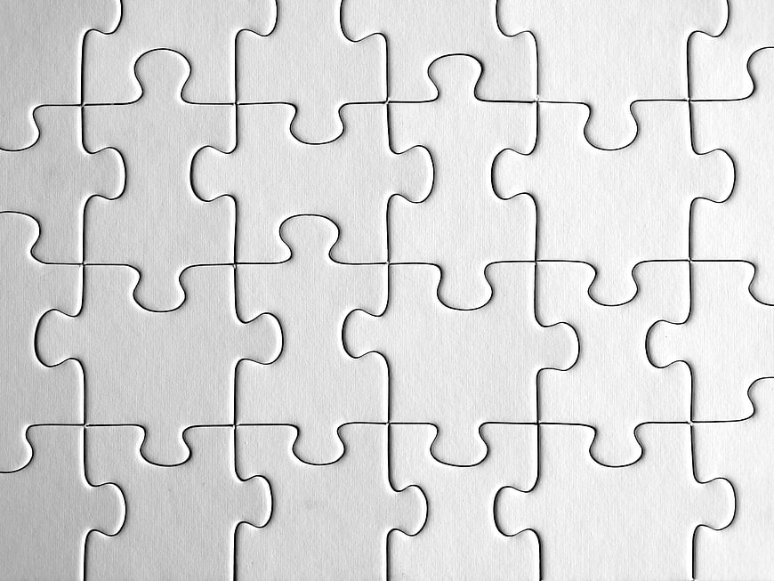 White jigsaw puzzle pieces background texture