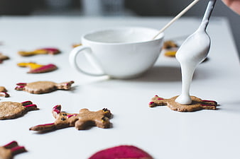 Decorating Easter bunny gingerbread cookies with white icing