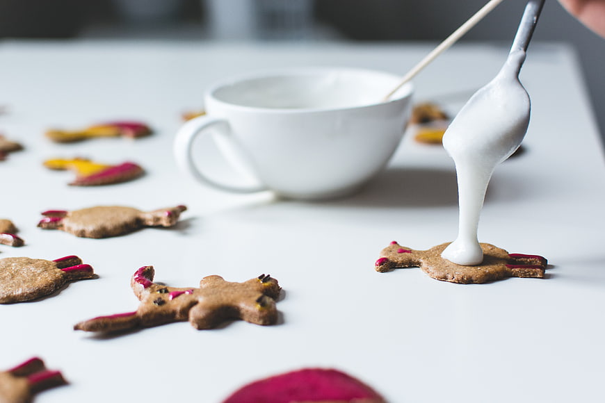 Decorating Easter bunny gingerbread cookies with white icing