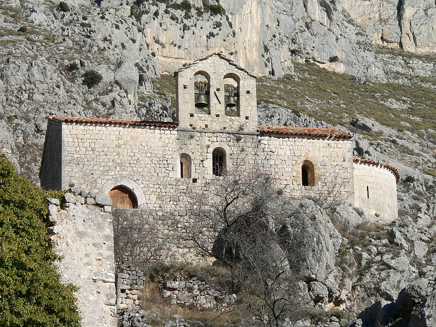 Ancient stone church built into rocky mountain cliffside