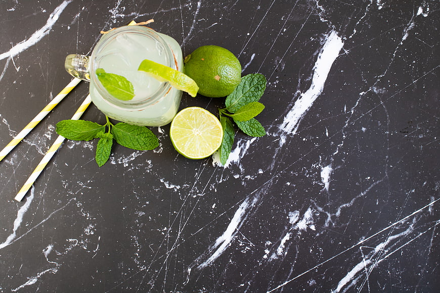 Refreshing Mojito Cocktail with Lime and Mint on Dark Marble