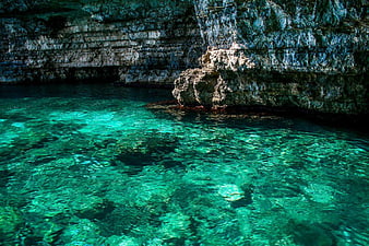 Crystal Clear Turquoise Water in Rocky Sea Cave