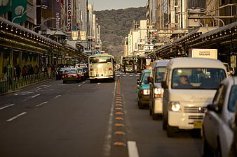 Busy Japanese City Street with Traffic and Shops