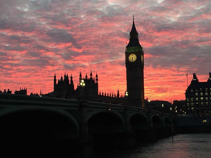 Big Ben and Westminster Palace Silhouette Against Vibrant Red Sunset Sky
