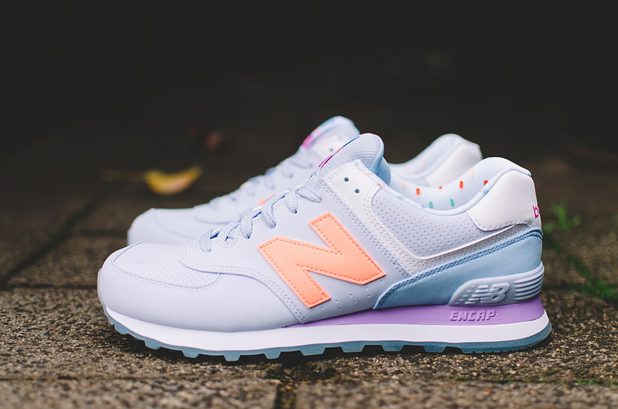 Pastel New Balance 574 Sneakers on Concrete