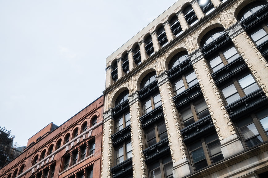 Low angle view of historic urban architecture with arched windows