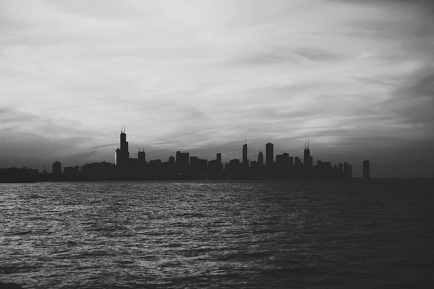 Black and White Chicago Skyline Silhouette Over Lake