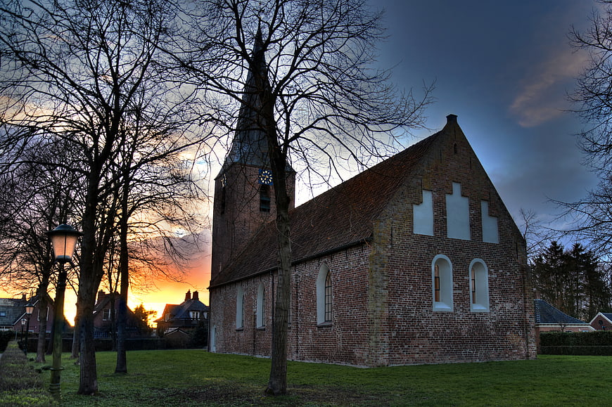 Historic Brick Church at Sunset with Bare Trees