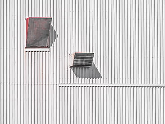 Abstract industrial corrugated metal wall with vents