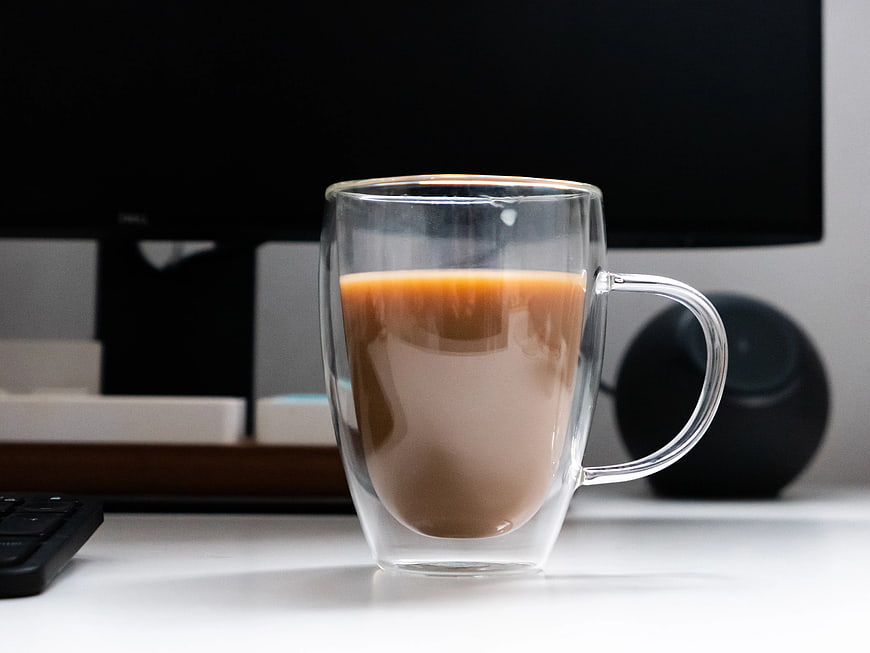 Double-Walled Glass Mug of Coffee on Office Desk