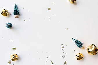 Minimalist Christmas Flat Lay with Gold Bells and Mini Trees