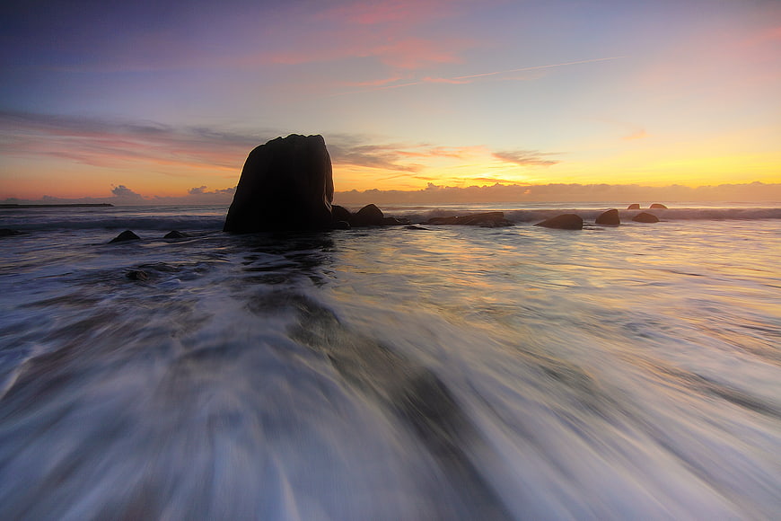 Long Exposure Sunset Ocean Waves Crashing on Rocks