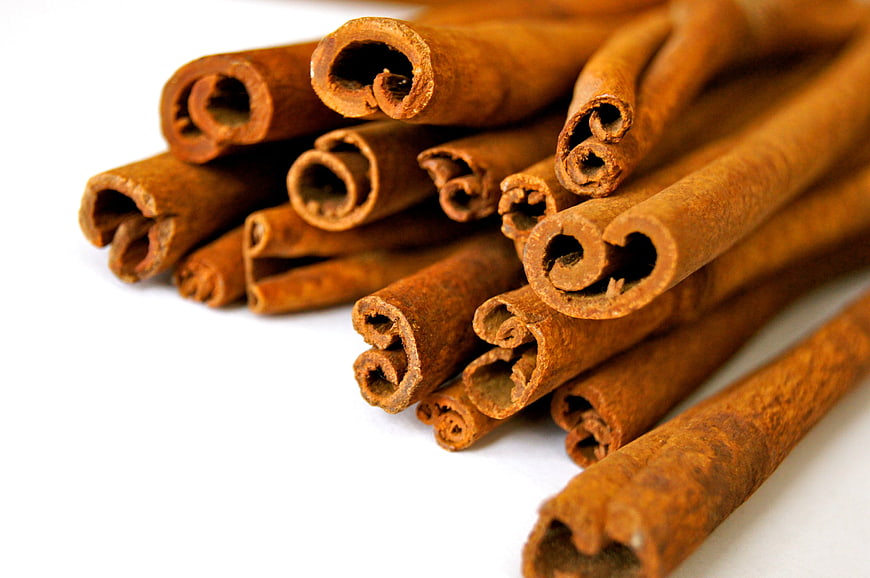 Close-up of cinnamon sticks on white background