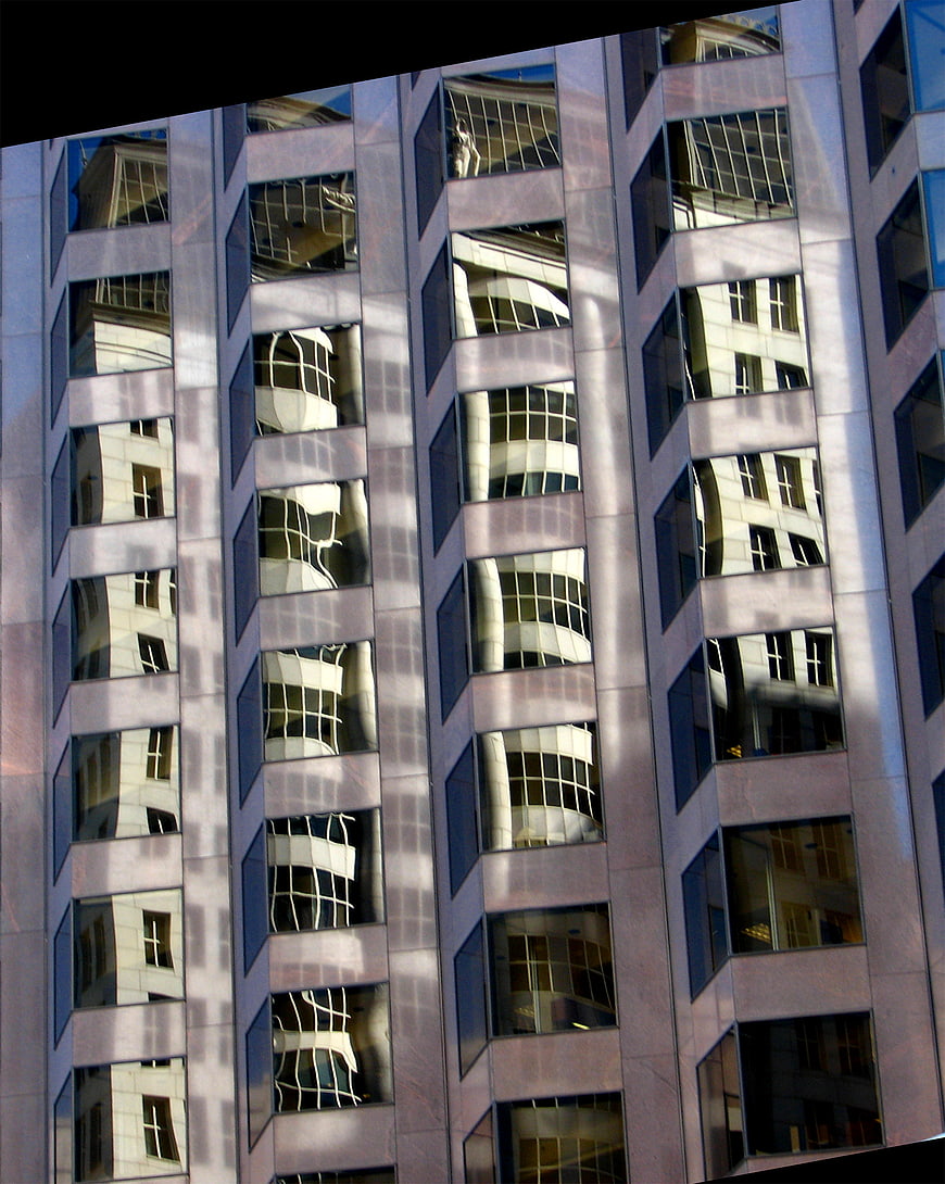 Modern building facade with distorted window reflections