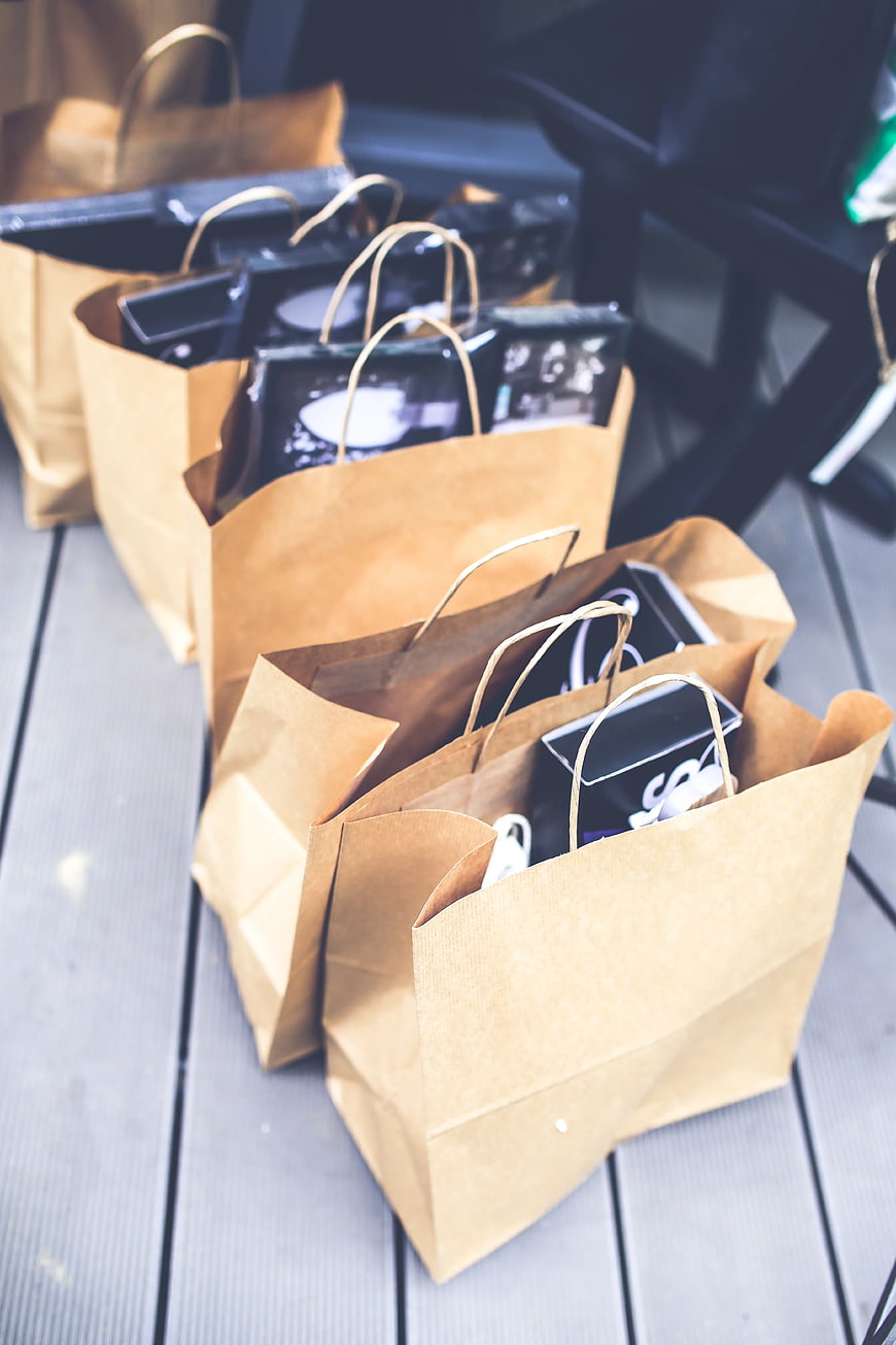 Brown paper shopping bags on wooden deck