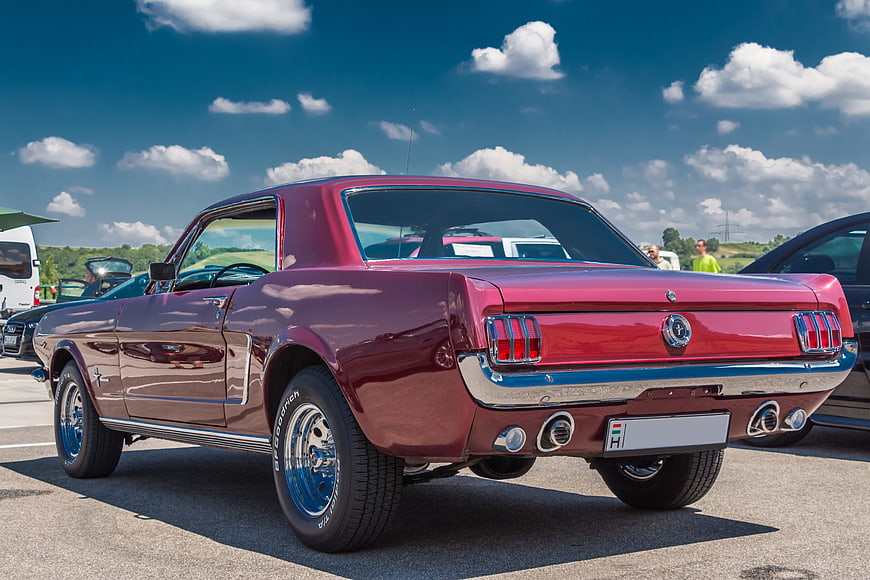 Rear Three-Quarter View Of Classic Maroon Ford Mustang Coupe