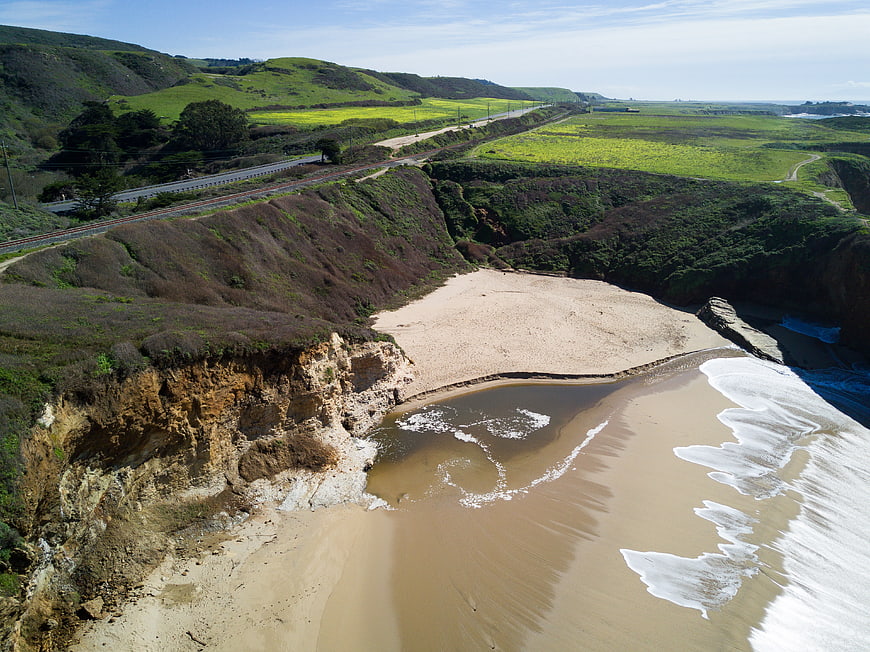 Aerial View of Coastal Cliffs and Sandy Beach